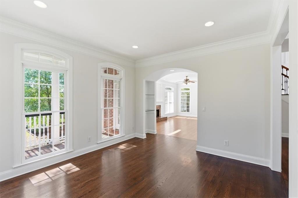 166 Windrift Drive Dallas, GA 30132 - Photo 7 of 72 an empty room with wooden floor and windows