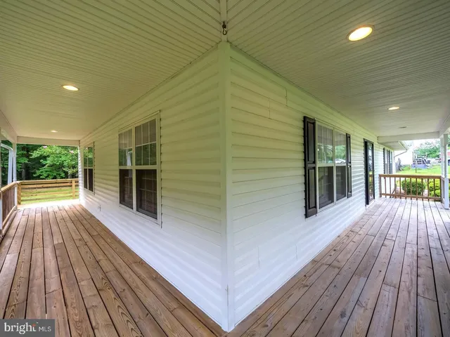 a view of backyard with sitting area