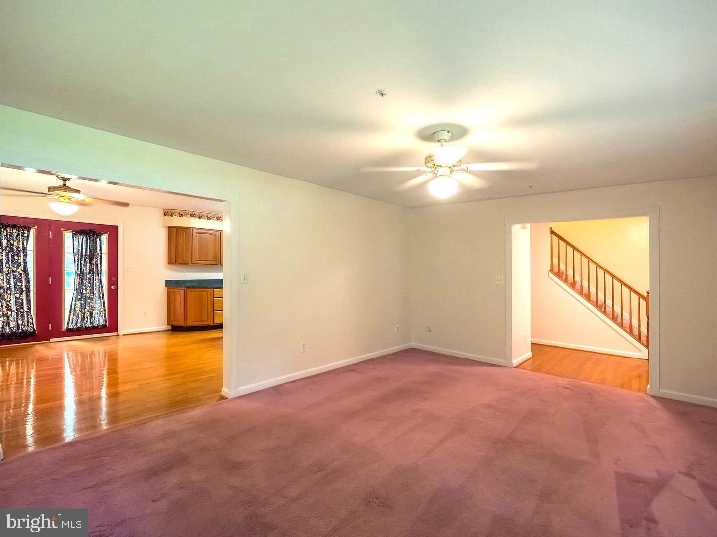 7701 Croom Road Upper Marlboro, MD 20772 - Photo 21 of 46 wooden floor in an empty room with a window