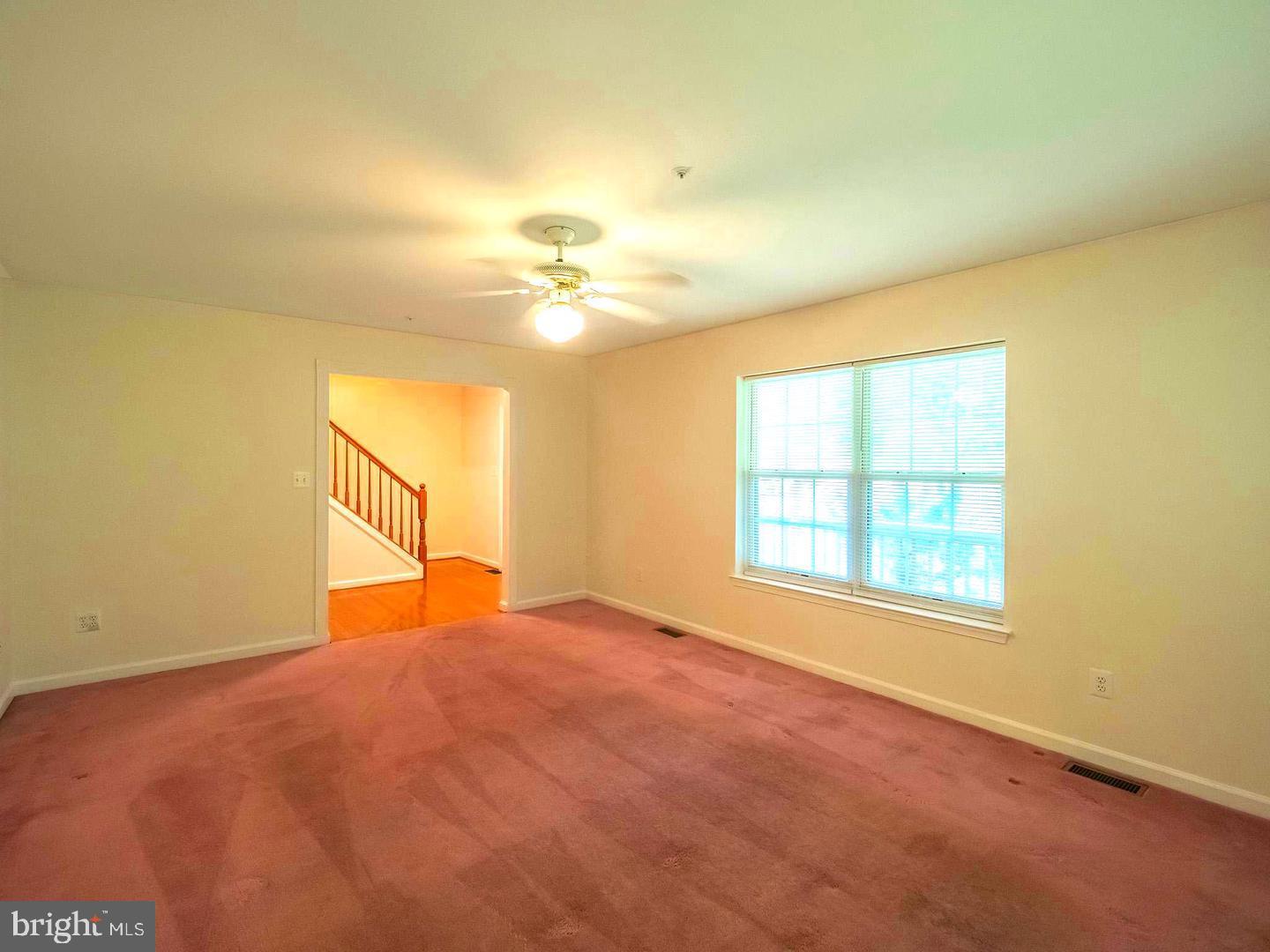7701 Croom Road Upper Marlboro, MD 20772 - Photo 22 of 46 an empty room with a empty space and windows