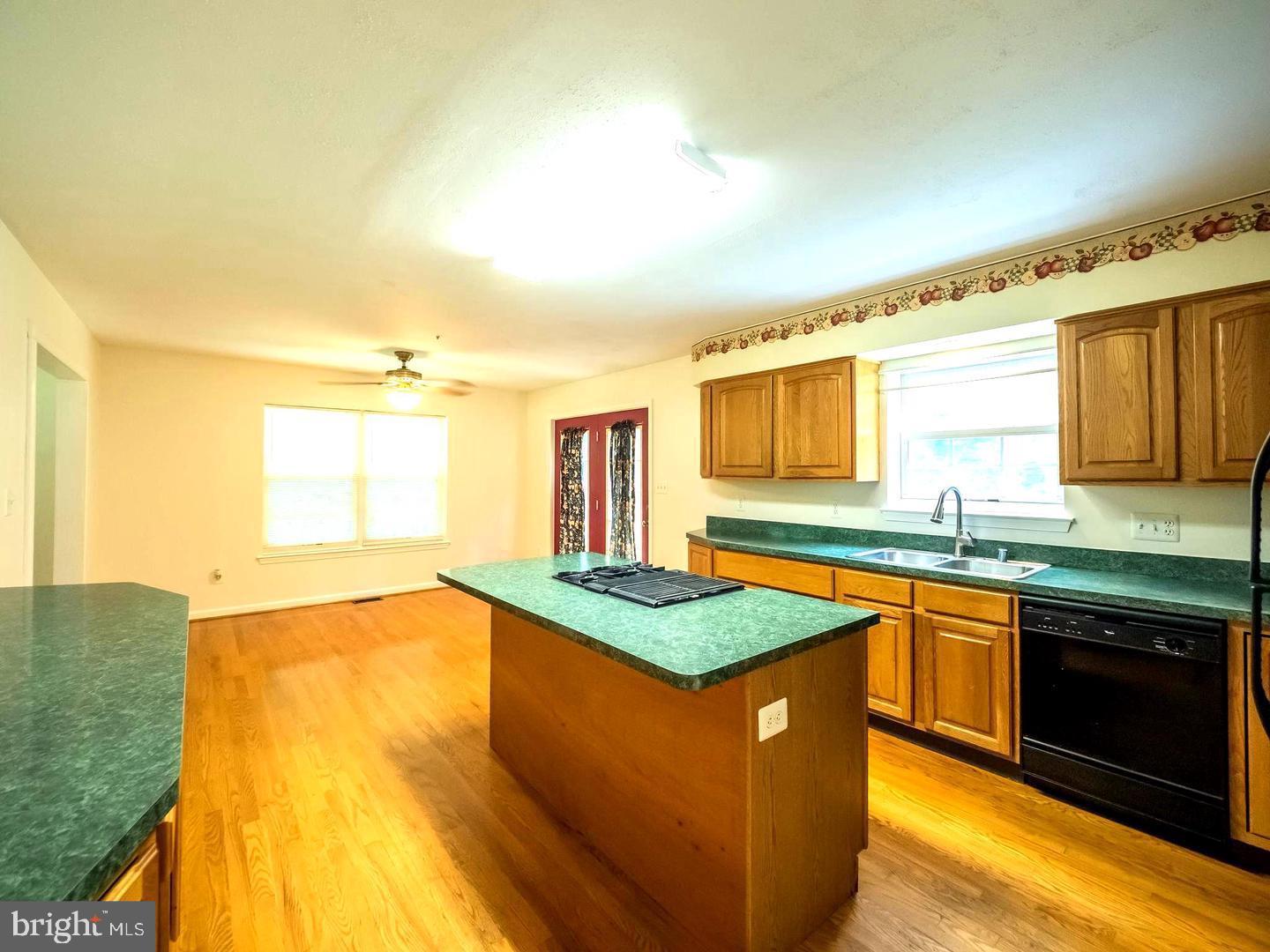 7701 Croom Road Upper Marlboro, MD 20772 - Photo 26 of 46 a kitchen with stainless steel appliances granite countertop a sink stove and cabinets
