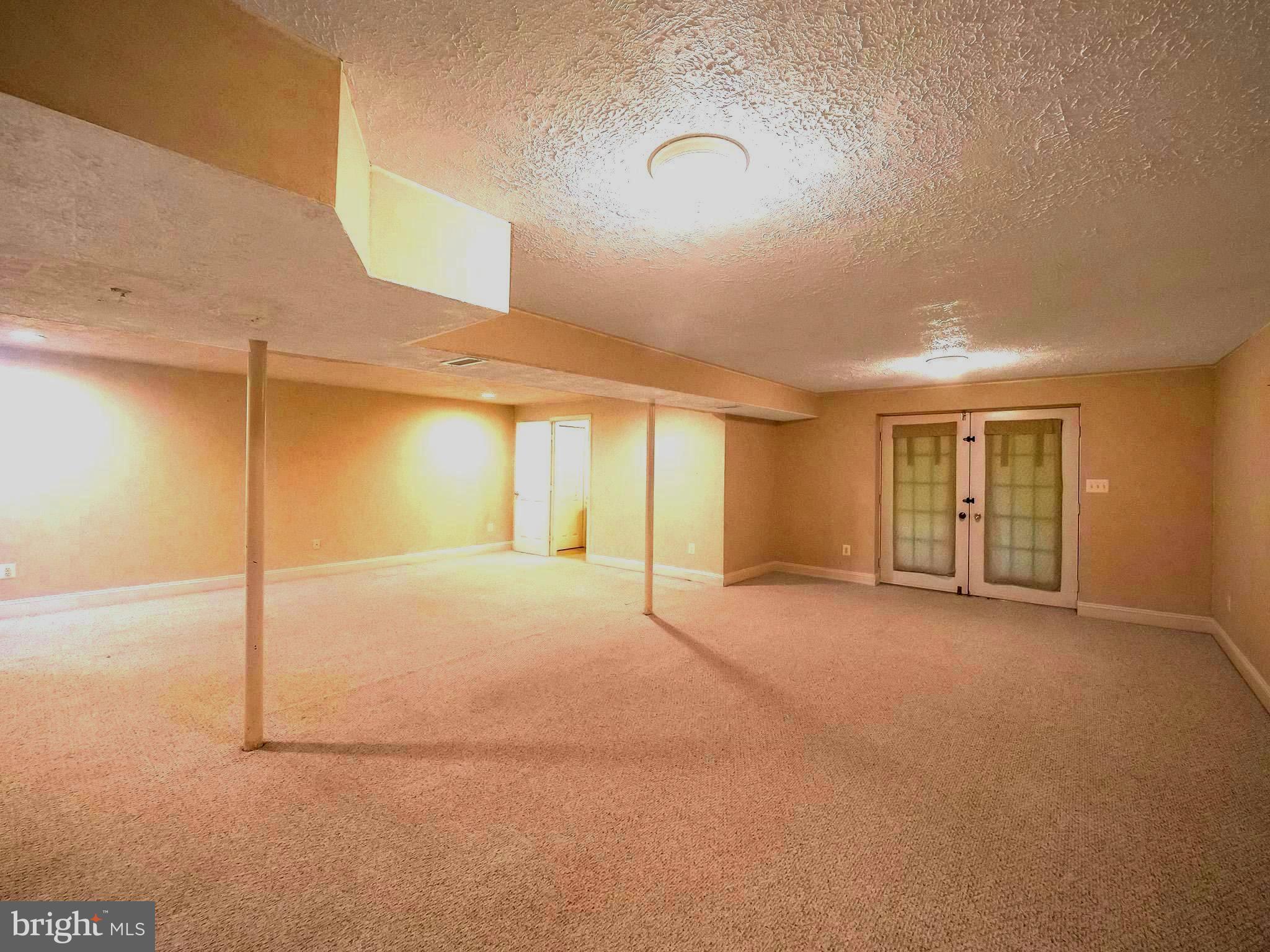 7701 Croom Road Upper Marlboro, MD 20772 - Photo 32 of 46 a view of an empty room with closet and window