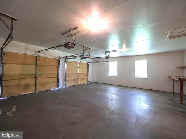 a view of empty room with windows