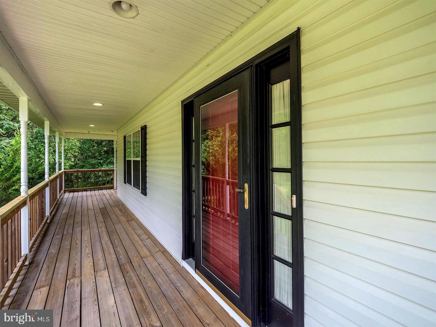 7701 Croom Road Upper Marlboro, MD 20772 - Photo 10 of 46 a view of balcony with wooden floor