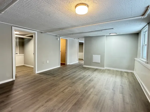 wooden floor in an empty room and a window