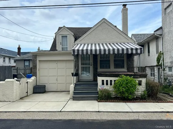 a front view of a house with garage