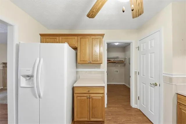 a kitchen with stainless steel appliances granite countertop a sink and cabinets