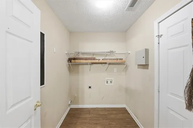 a view of a livingroom with furniture and windows