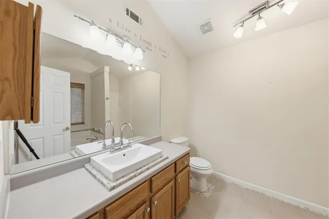 a white bath tub sitting next to a shower