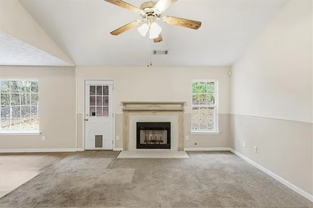 wooden floor in an empty room with a fireplace