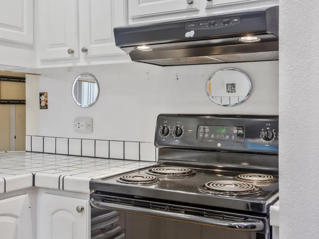 a kitchen with a sink and a microwave