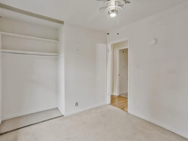 a view of an empty room and window