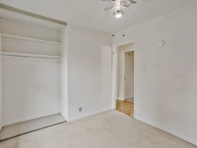 a view of an empty room and window