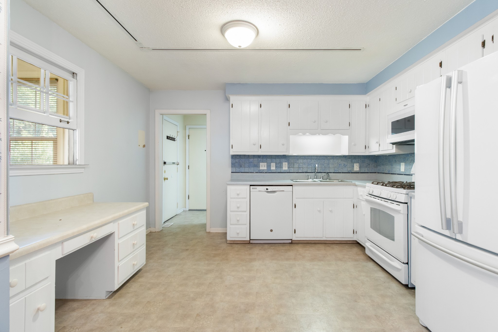 307 Revere Road Clarksville, TN 37043 - Photo 14 of 38 a kitchen with granite countertop white cabinets and white appliances