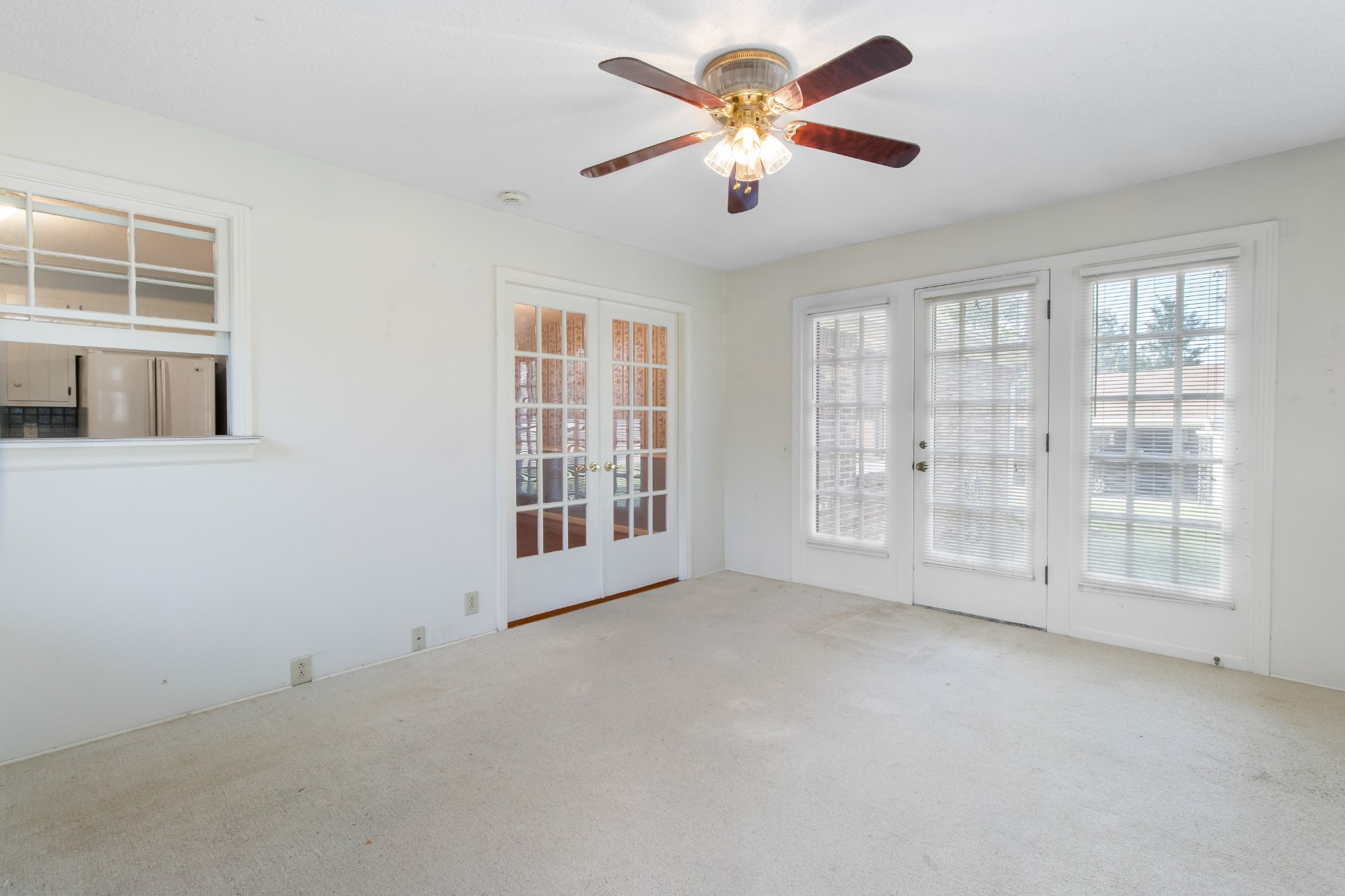 307 Revere Road Clarksville, TN 37043 - Photo 17 of 38 an empty room with chandelier fan and windows