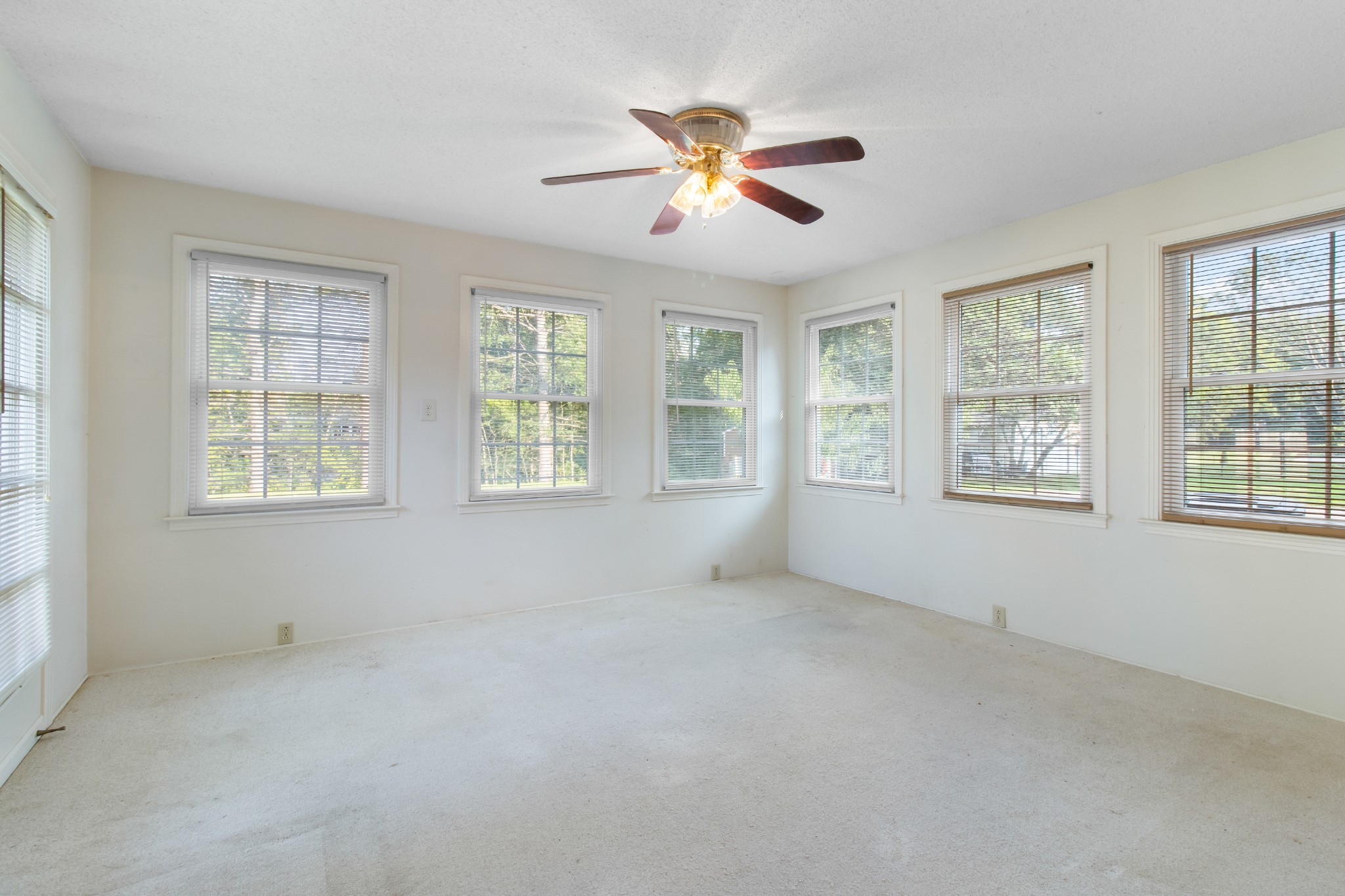 307 Revere Road Clarksville, TN 37043 - Photo 18 of 38 an empty room with windows and chandelier fan