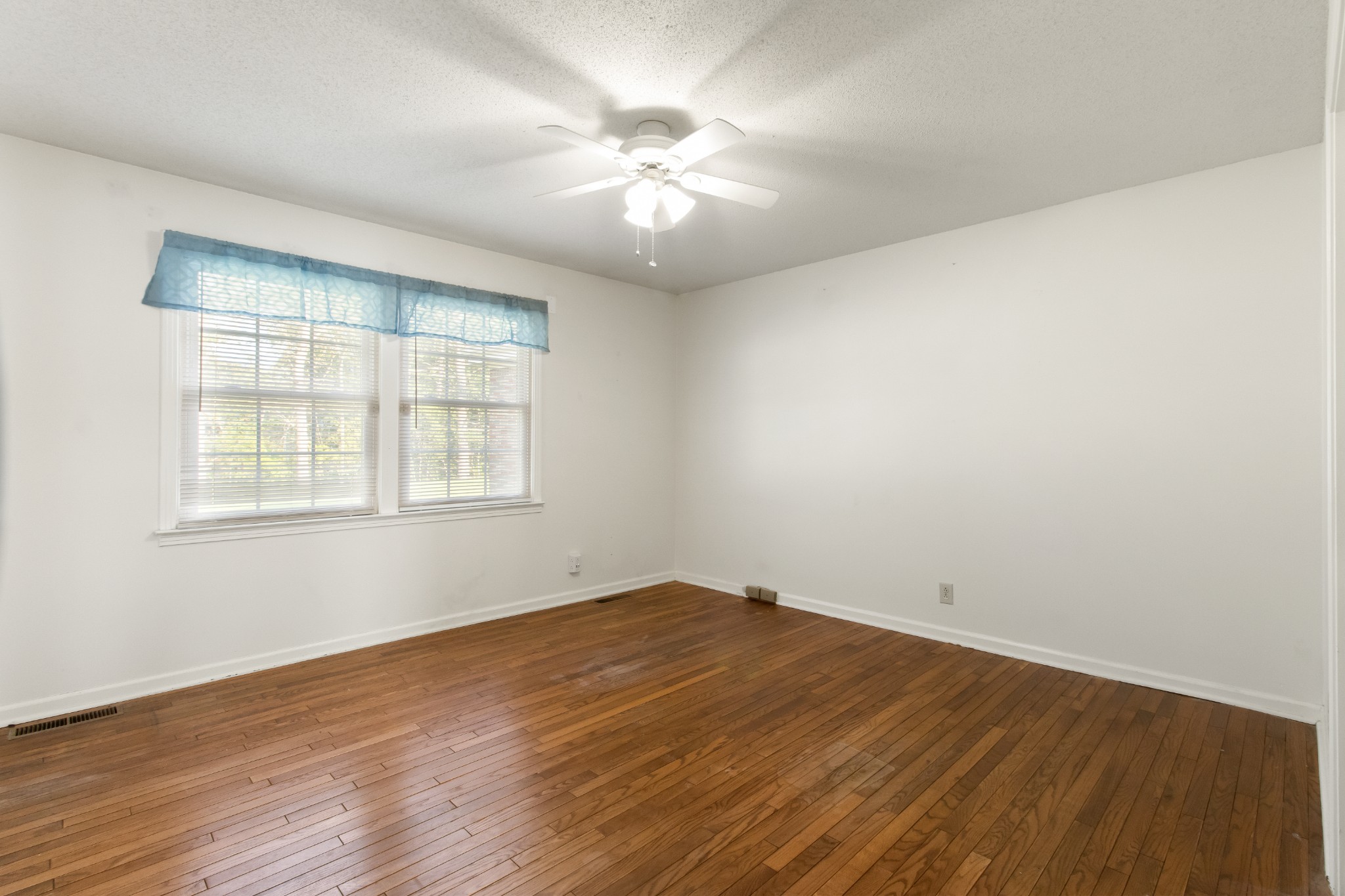 307 Revere Road Clarksville, TN 37043 - Photo 25 of 38 an empty room with wooden floor and windows
