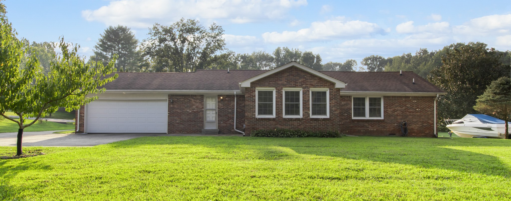 307 Revere Road Clarksville, TN 37043 - Photo 31 of 38 a front view of a house with a garden and yard