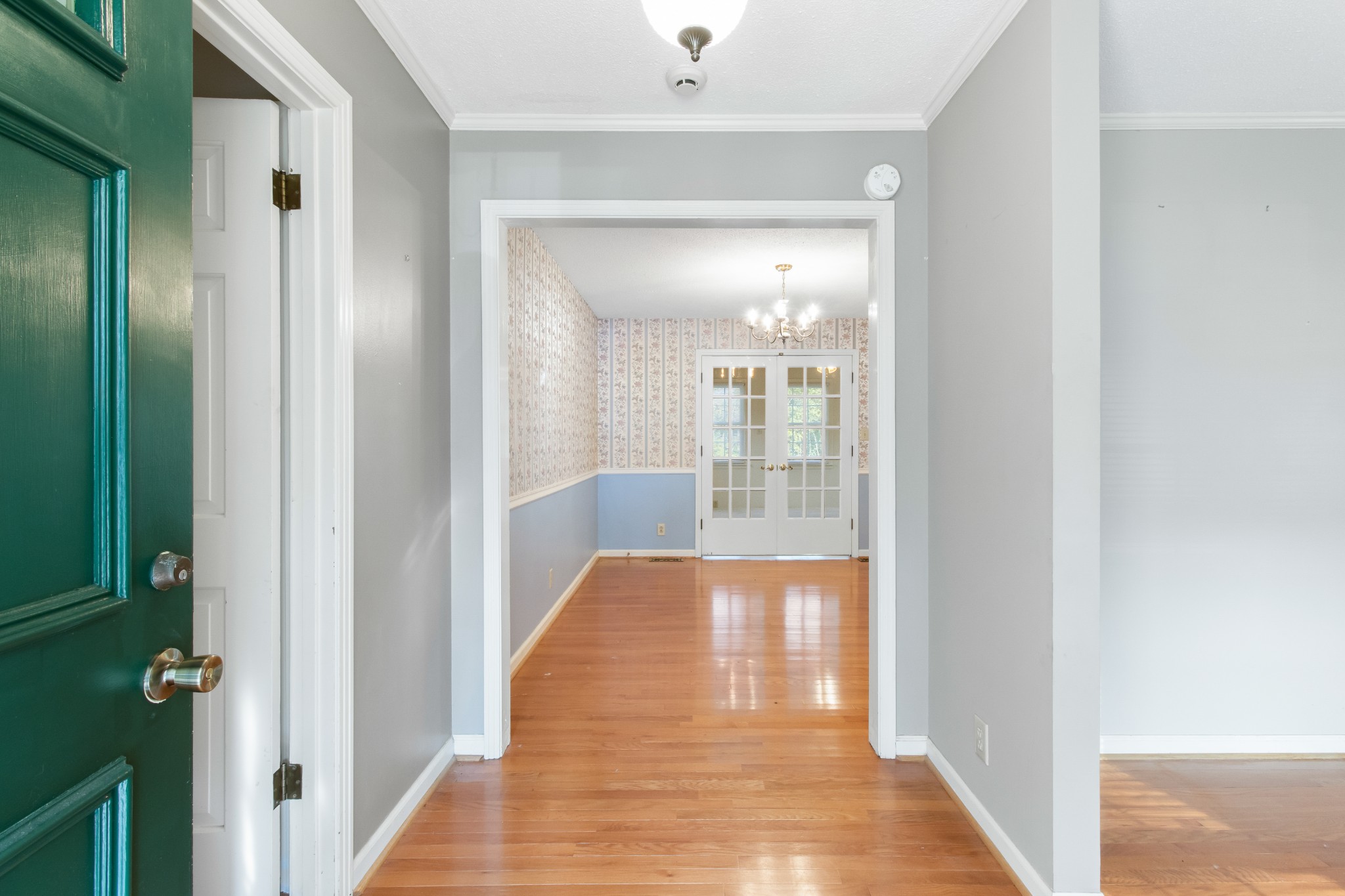 307 Revere Road Clarksville, TN 37043 - Photo 8 of 38 a view of a hallway with wooden floor and a bathroom