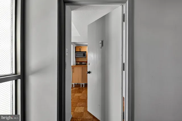 a view of a bedroom from a hallway