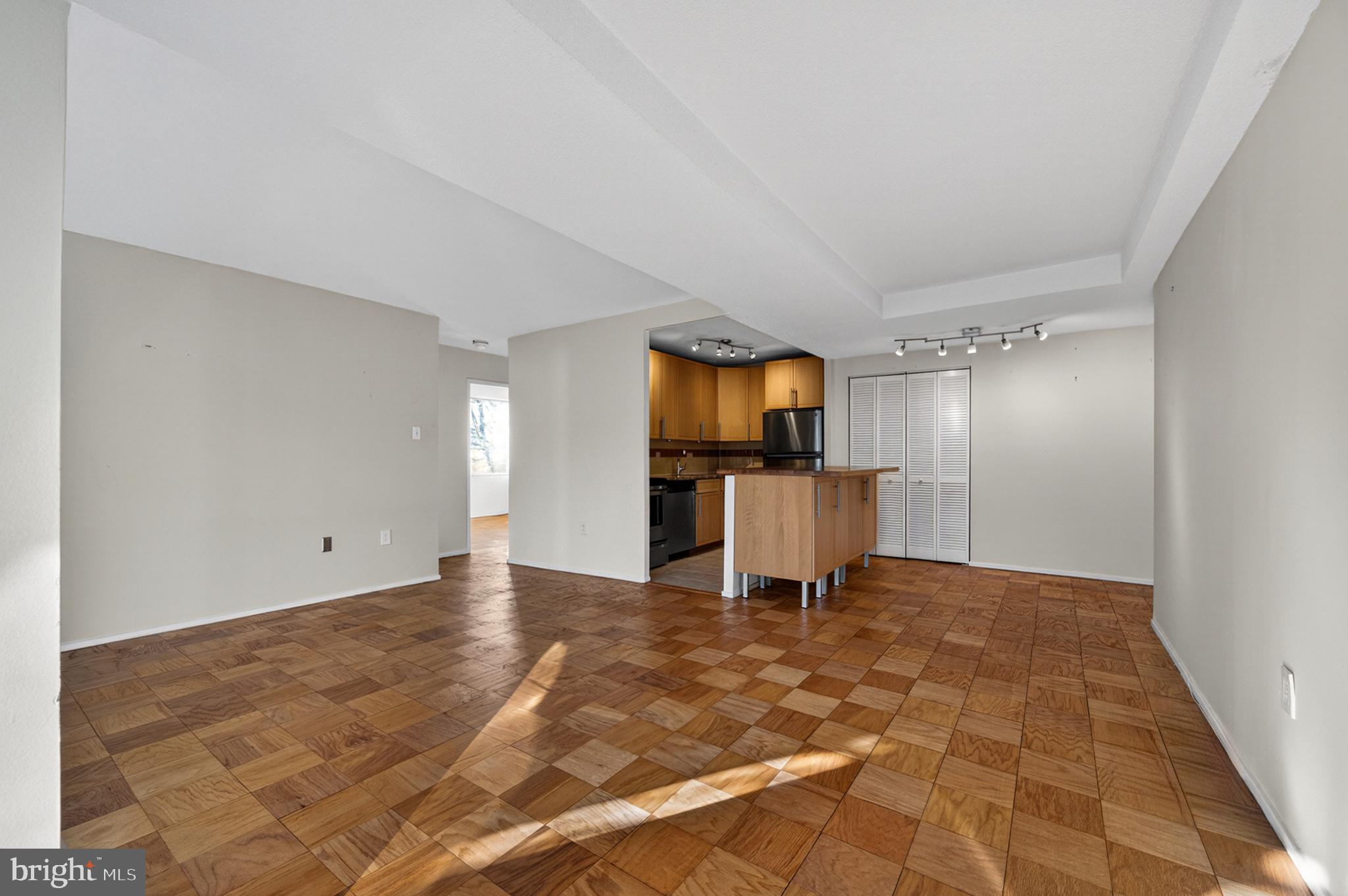 1311 Delaware Avenue Southwest, Unit S231 Washington, DC 20024 - Photo 6 of 74 a view of a kitchen with a sink and a refrigerator