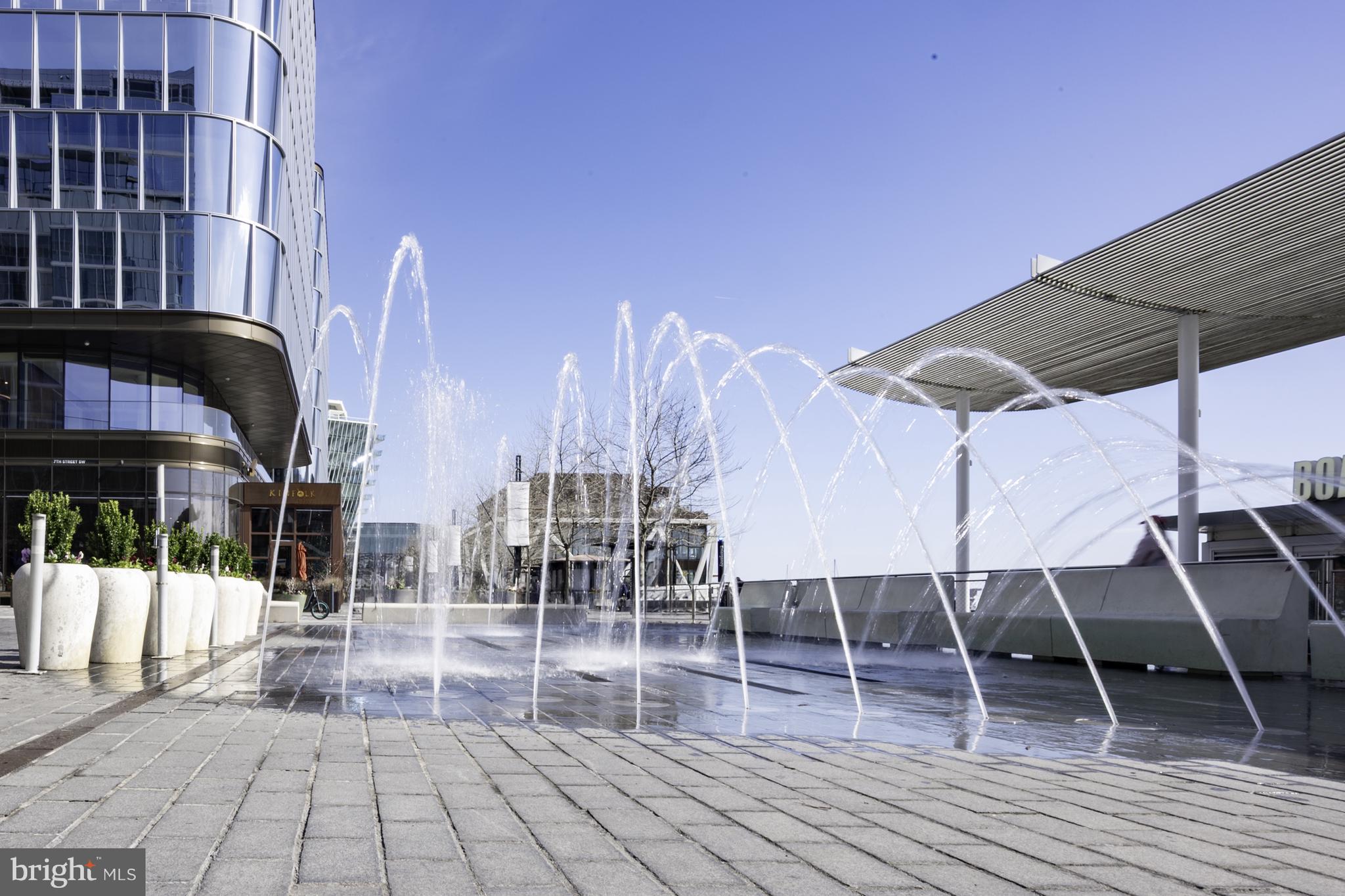 1311 Delaware Avenue Southwest, Unit S231 Washington, DC 20024 - Photo 73 of 74 a view of a patio with a table and chairs