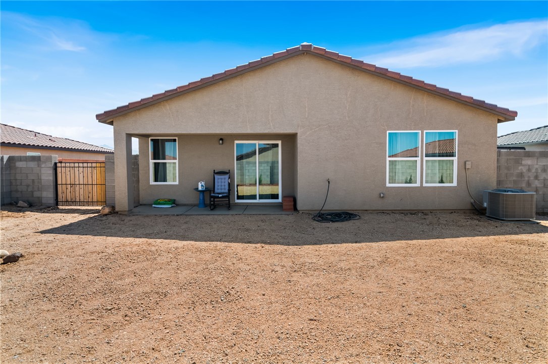 3623 East Andrea Drive Kingman, AZ 86409 - Photo 39 of 40 The property features a stucco exterior, a tiled roof, and a covered patio area