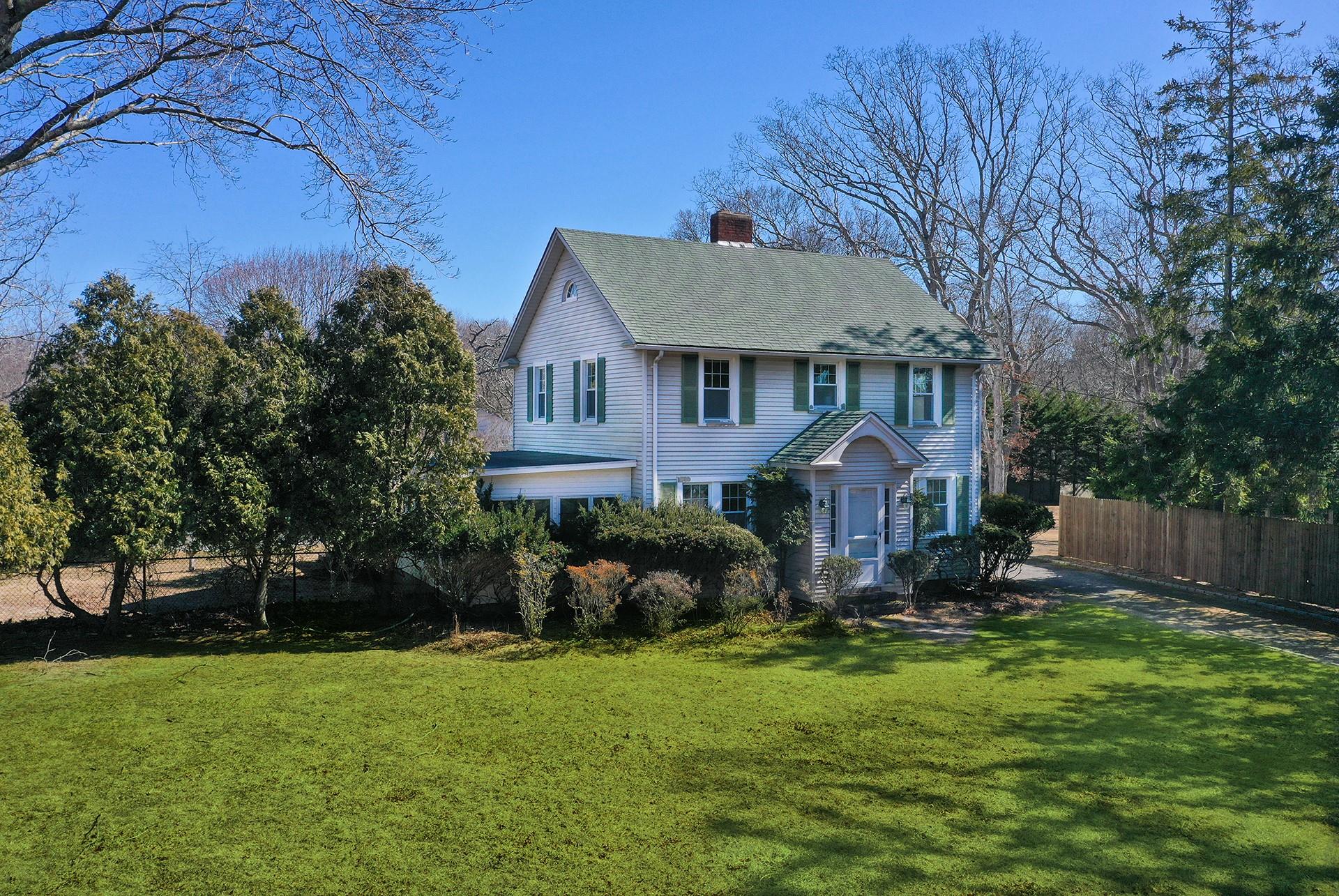 12 Summit Boulevard Westhampton, NY 11977 - Photo 1 of 1 a front view of a house with garden