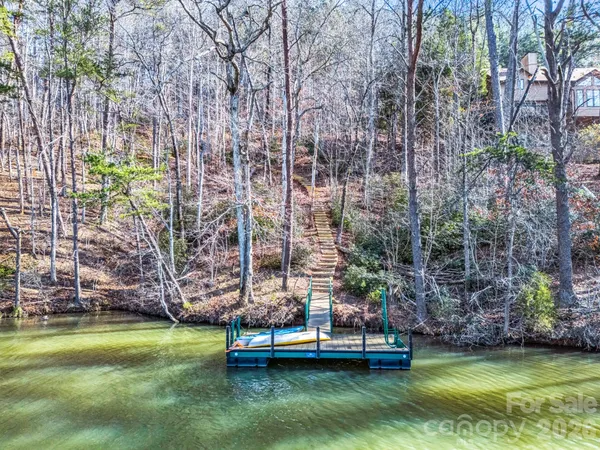 a swimming pool with trees in the background