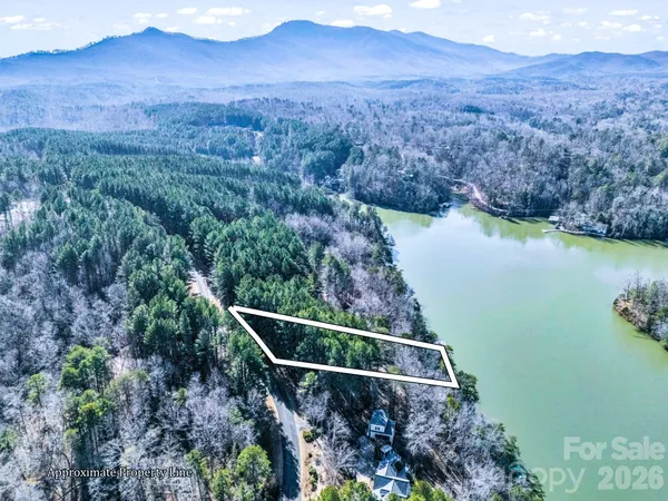 an aerial view of house with yard