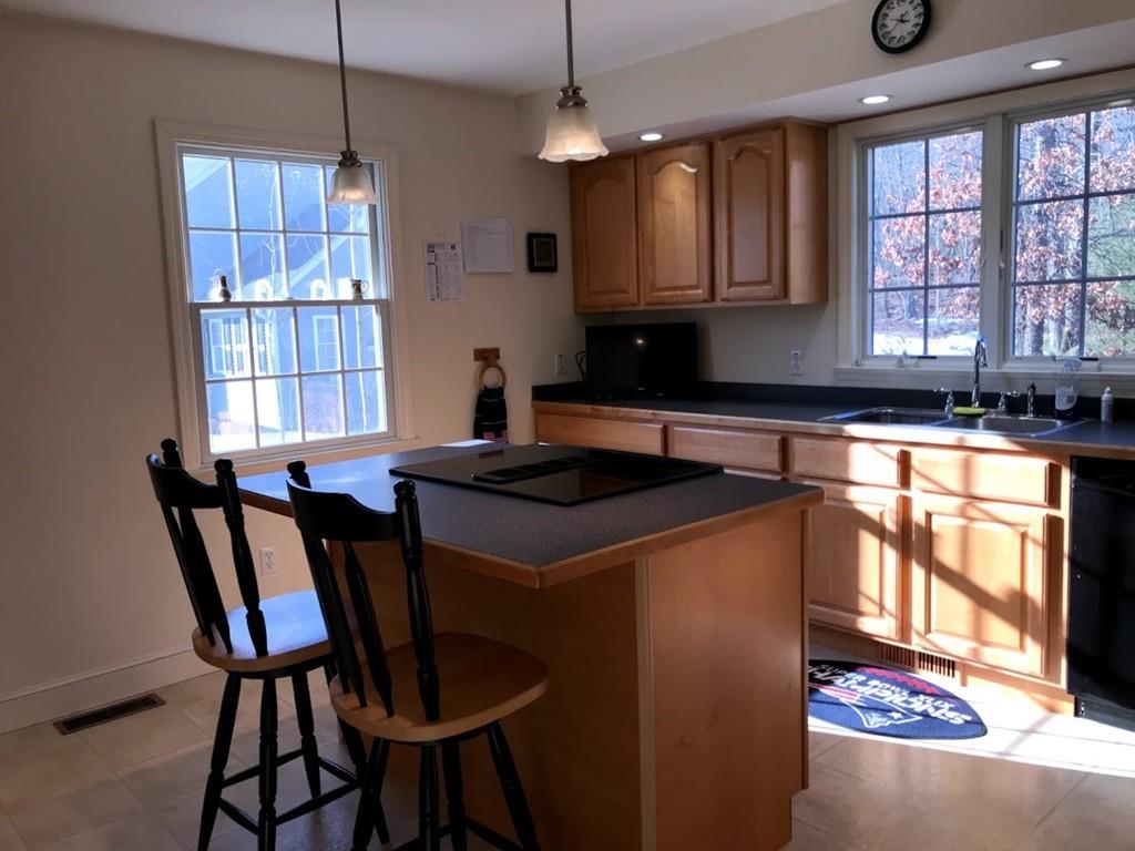 48 Catacunemaug Road Shirley, MA 01464 - Photo 14 of 28 a kitchen that has a cabinets window and stainless steel appliances