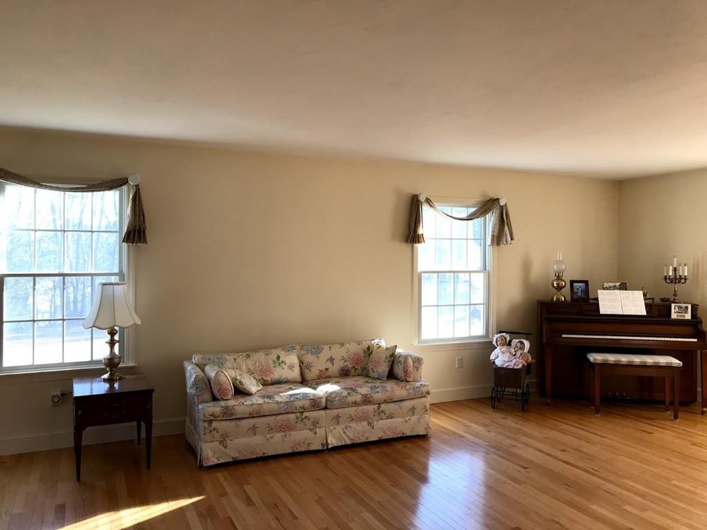 48 Catacunemaug Road Shirley, MA 01464 - Photo 18 of 28 a living room with furniture and a window