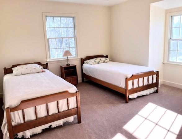48 Catacunemaug Road Shirley, MA 01464 - Photo 27 of 28 a bedroom with two beds and window
