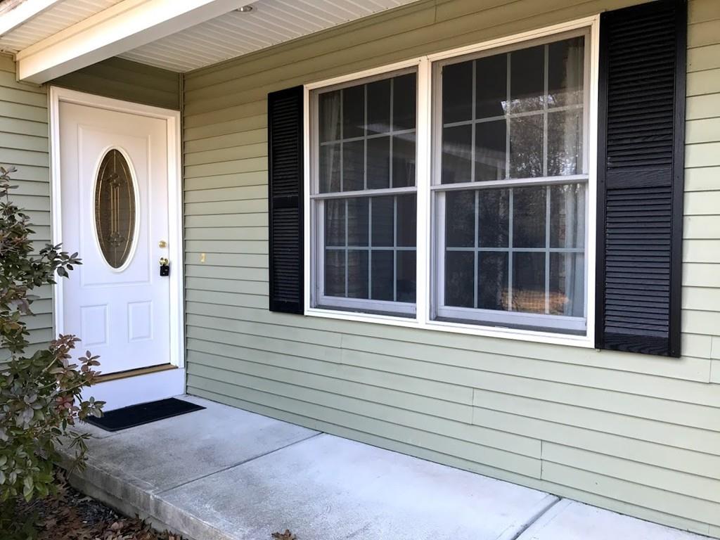 48 Catacunemaug Road Shirley, MA 01464 - Photo 3 of 28 a front view of a house with a yard