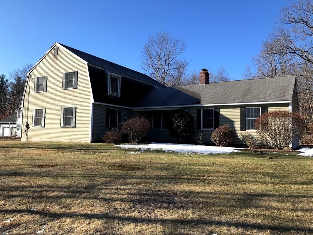 48 Catacunemaug Road Shirley, MA 01464 - Photo 5 of 28 a front view of a house with a yard