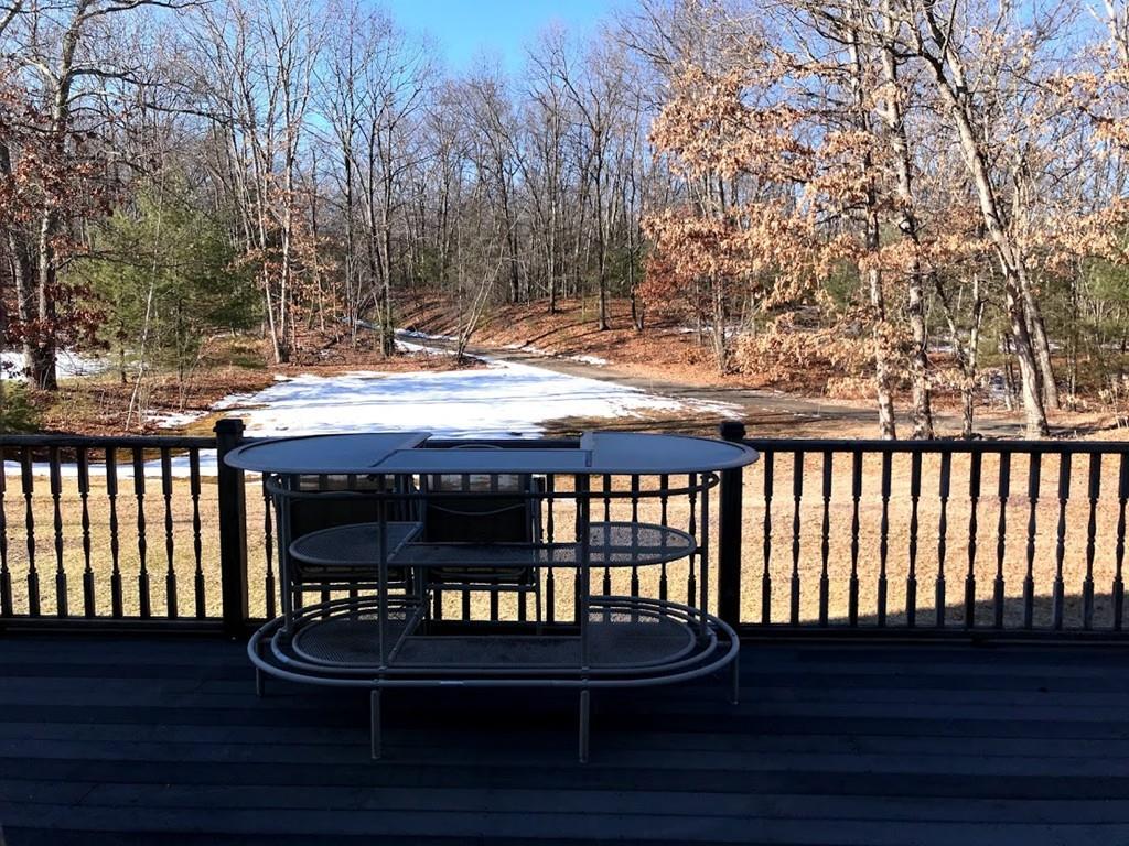 48 Catacunemaug Road Shirley, MA 01464 - Photo 8 of 28 a wooden bench sitting on top of a wooden floor