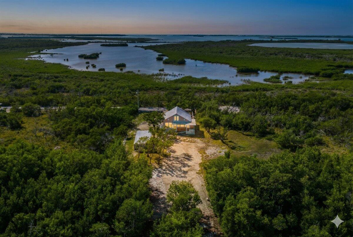 3167 Stewart Road Summerland Key, FL 33042 - Photo 33 of 33 a view of a lake with houses in the back