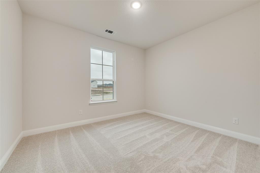 1013 Canoe Way Crowley, TX 76036 - Photo 15 of 26 an empty room with a window