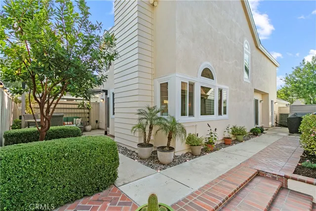 a front view of a house with sitting area