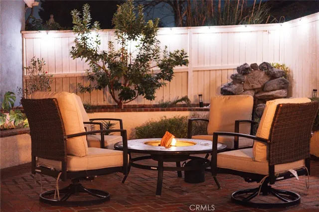 a outdoor sitting area with furniture and wooden floor