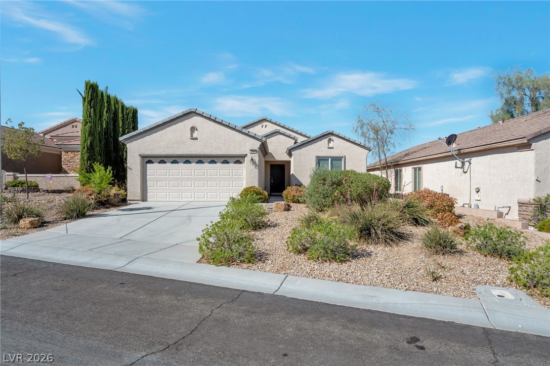 2535 Anani Road Henderson, NV 89044 - Photo 1 of 13 A neatly maintained desert-landscaped yard frames this inviting single-story residence with an attached garage.