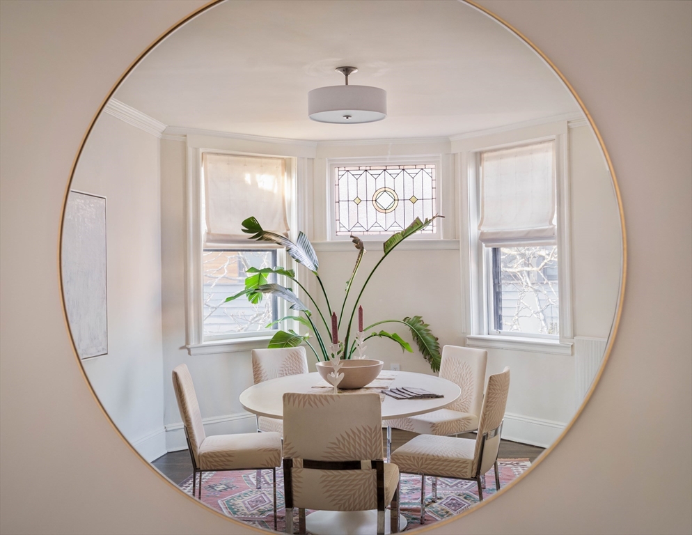 4 Newport Road, Unit 7 Cambridge, MA 02140 - Photo 11 of 31 a view of a dining room with furniture window and wooden floor