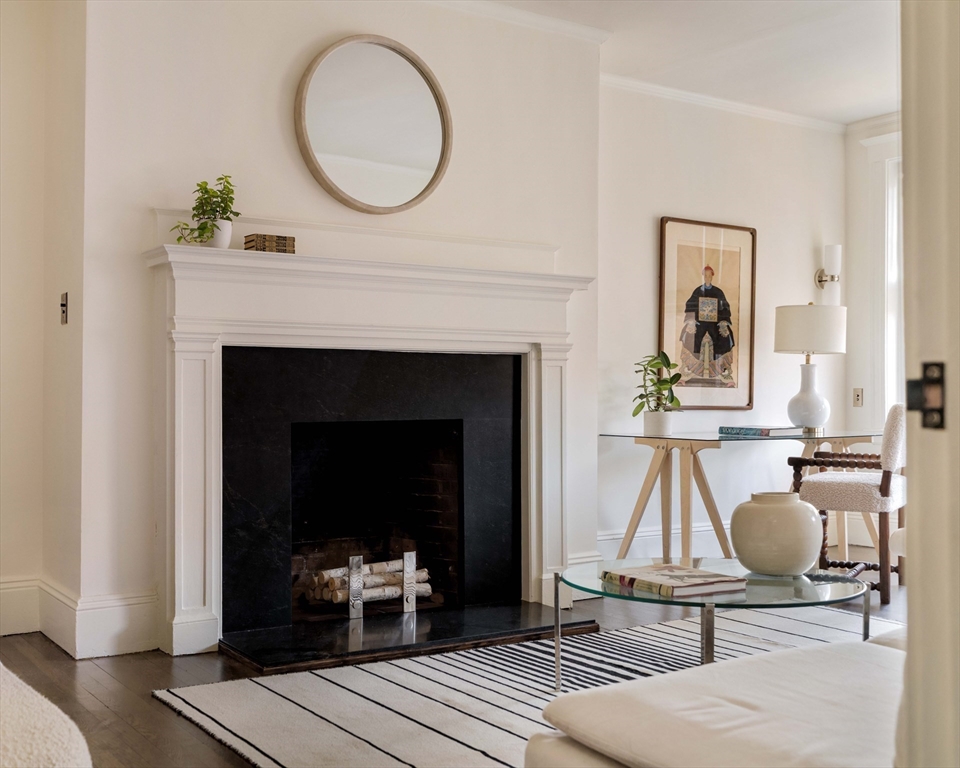 4 Newport Road, Unit 7 Cambridge, MA 02140 - Photo 16 of 31 a living room with furniture and a fireplace