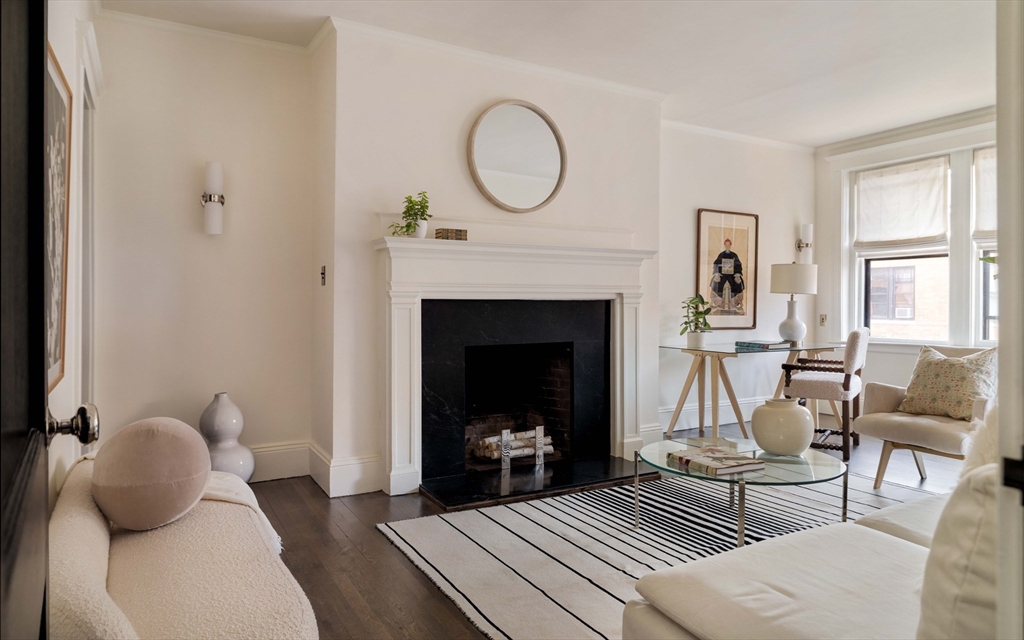 4 Newport Road, Unit 7 Cambridge, MA 02140 - Photo 17 of 31 a living room with furniture and a fireplace