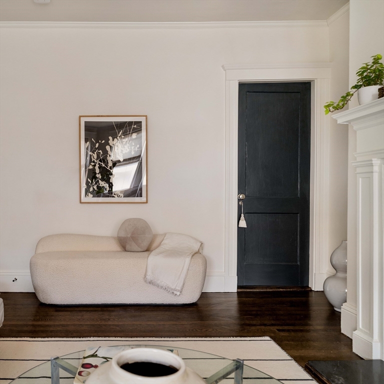 4 Newport Road, Unit 7 Cambridge, MA 02140 - Photo 18 of 31 a living room with furniture and wooden floor