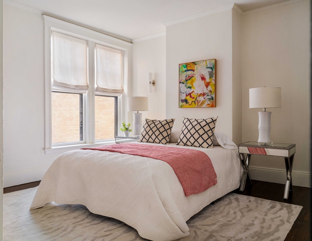 4 Newport Road, Unit 7 Cambridge, MA 02140 - Photo 19 of 31 a bedroom with a bed and a couch