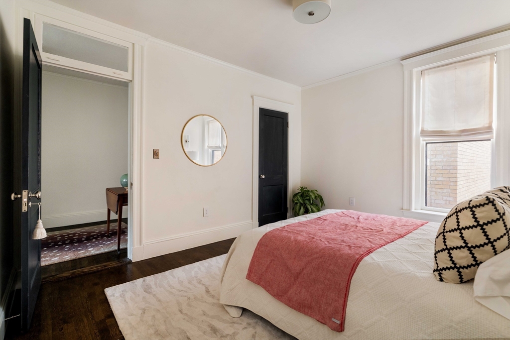 4 Newport Road, Unit 7 Cambridge, MA 02140 - Photo 20 of 31 a bedroom with a bed and a window