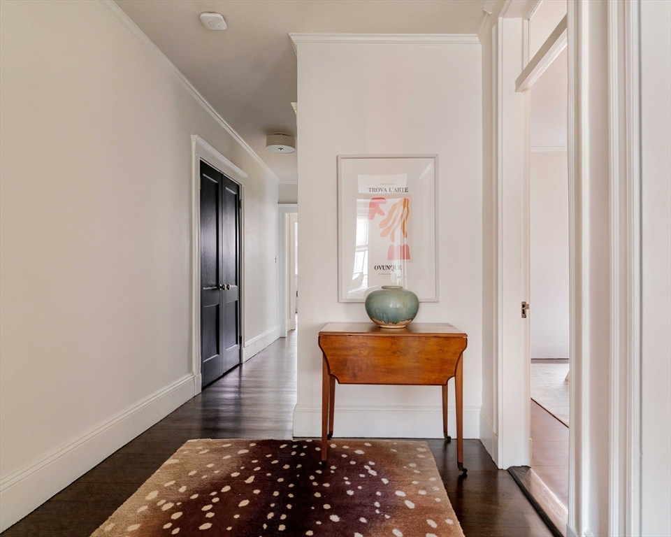 4 Newport Road, Unit 7 Cambridge, MA 02140 - Photo 2 of 31 a bedroom with a bed and furniture