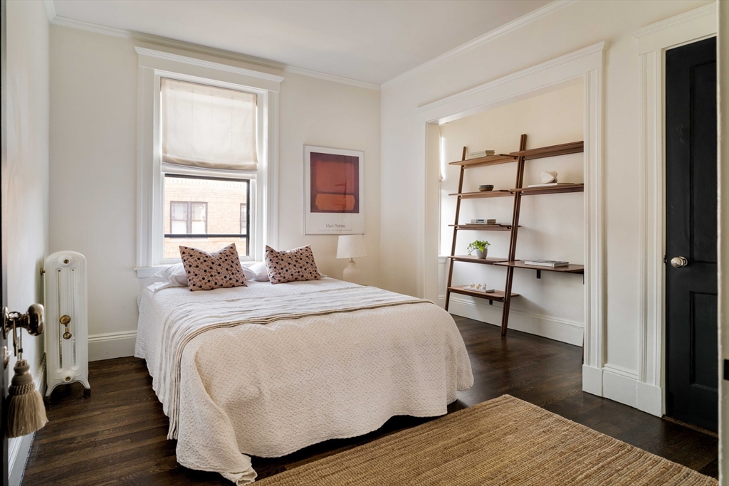 4 Newport Road, Unit 7 Cambridge, MA 02140 - Photo 21 of 31 a bedroom with a bed and a window