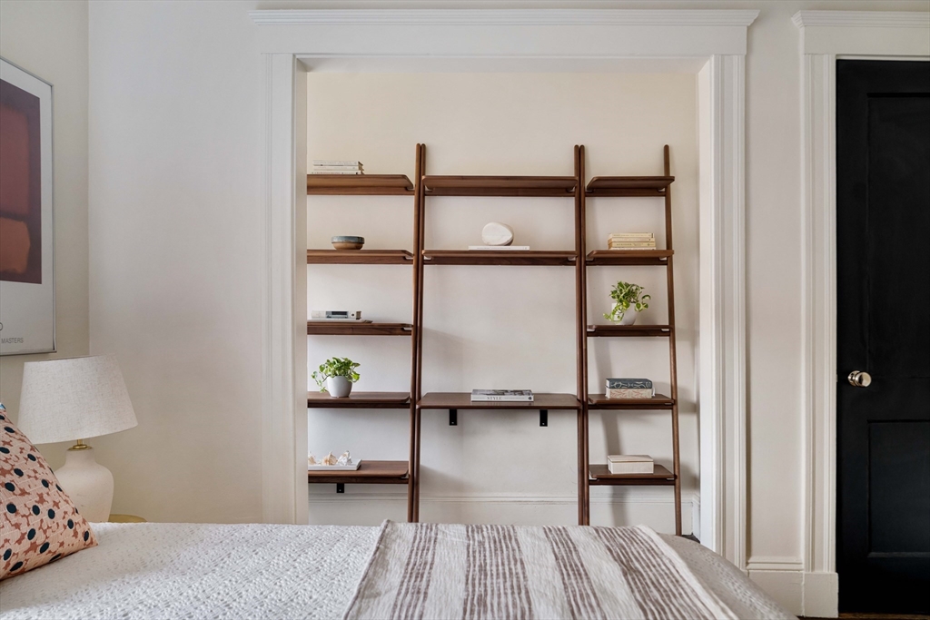 4 Newport Road, Unit 7 Cambridge, MA 02140 - Photo 22 of 31 a bedroom with a bed and wooden floor